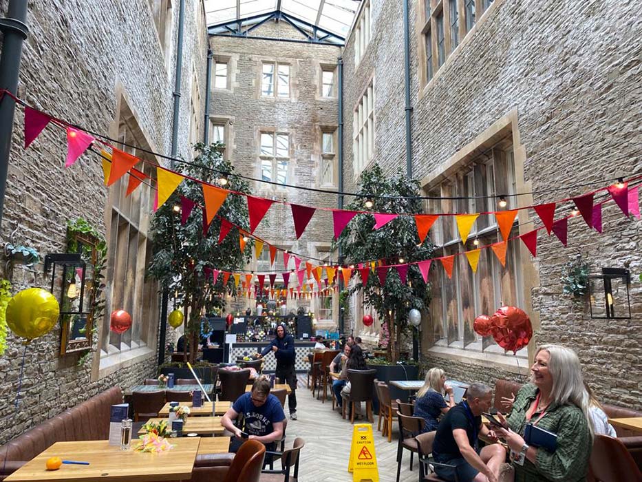 warm hue bunting in between buildings