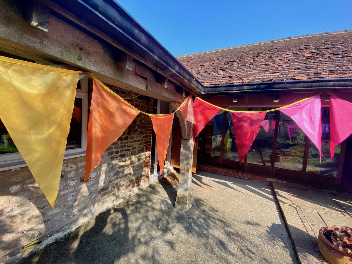 warm hues oversized rainbow satin bunting