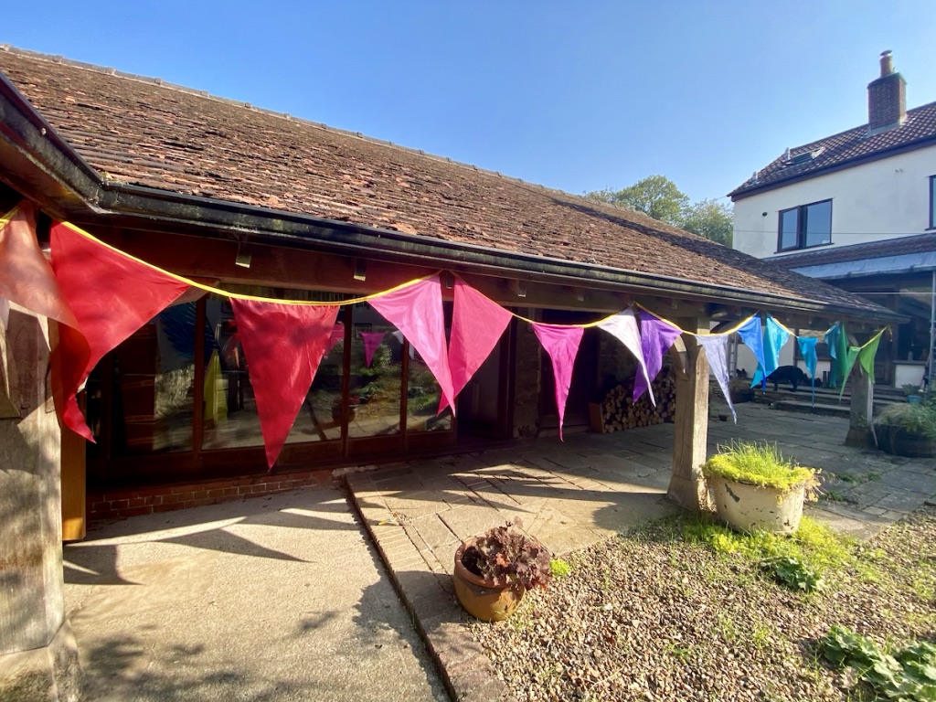 oversized rainbow bunting satin