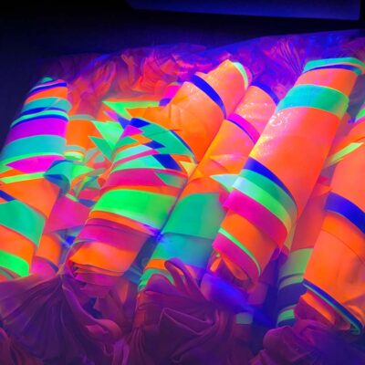 Oversized neon bunting glowing in UV light